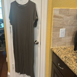 Super cute and comfy T-shirt dress. Small white accents on love green fabric.
